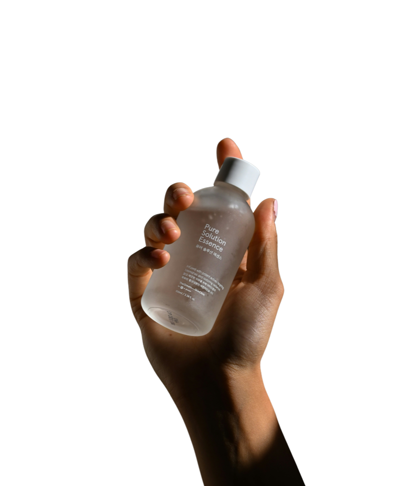 Hand holding a Sorcea-tested serum bottle